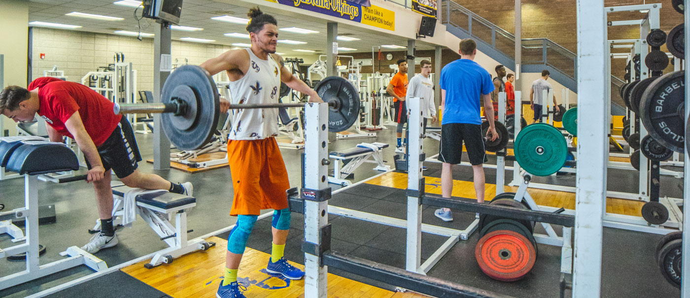 Men lifting weights