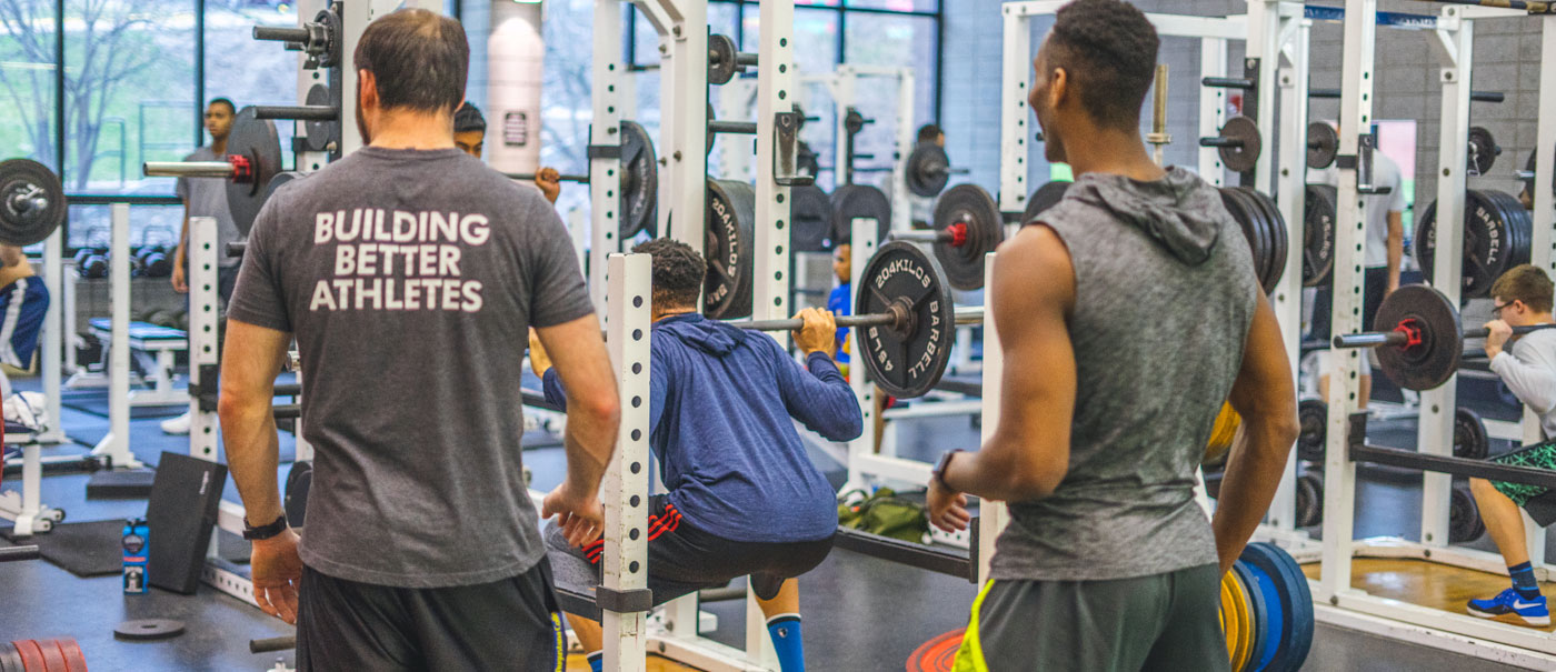 Men lifting weights