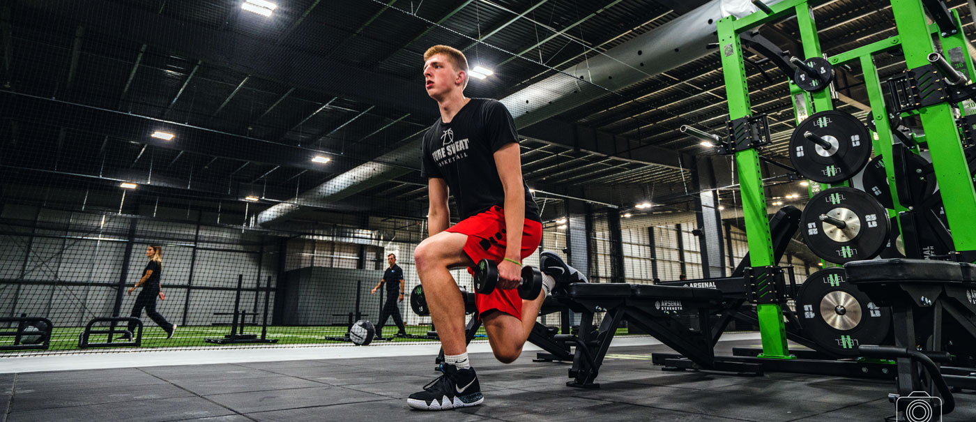 A picture of a man exercising with dumbbells